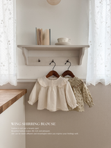 Wing shirring blouse