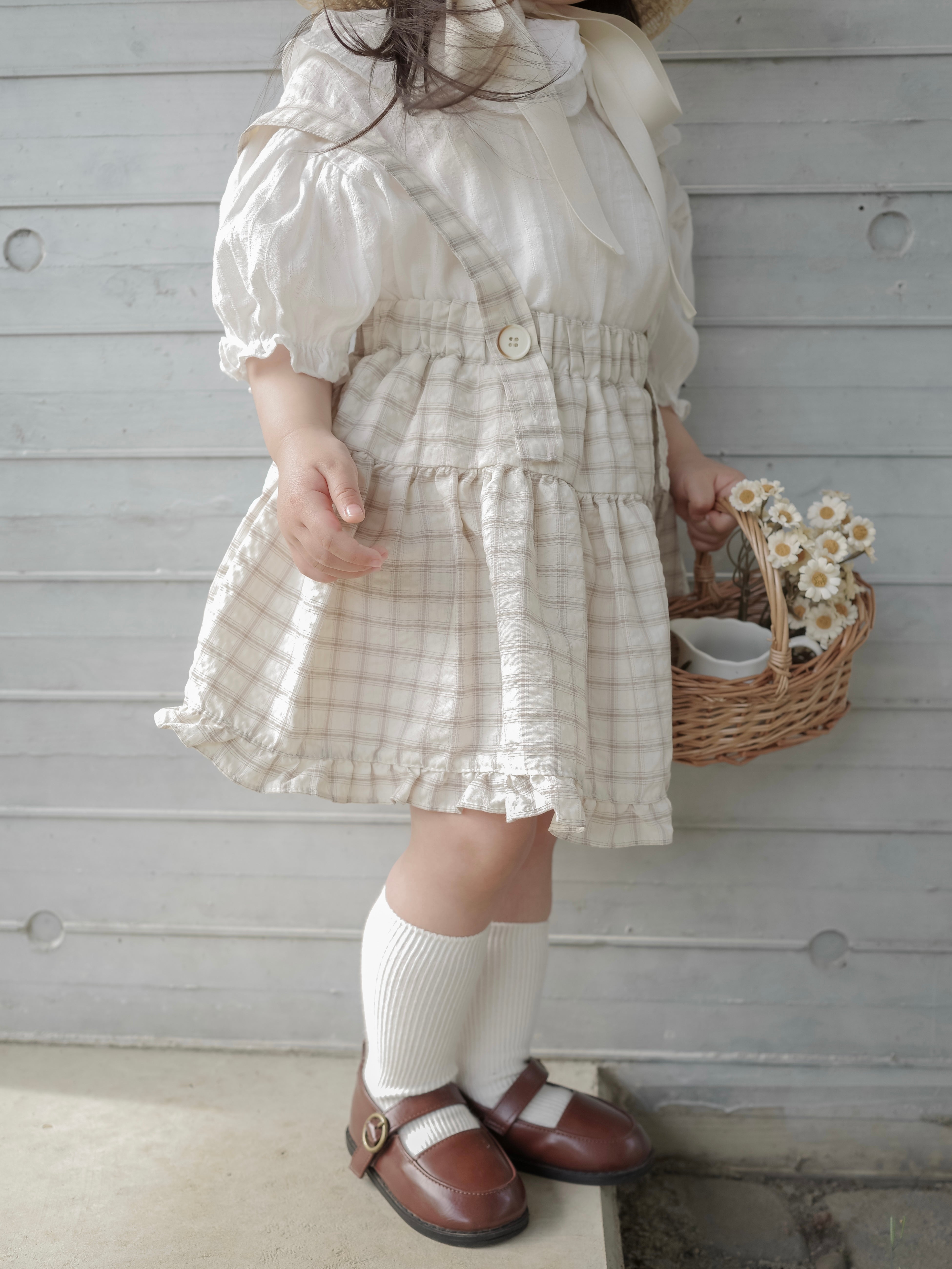 Pair check suspender skirt