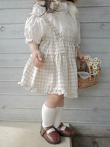 Pair check suspender skirt