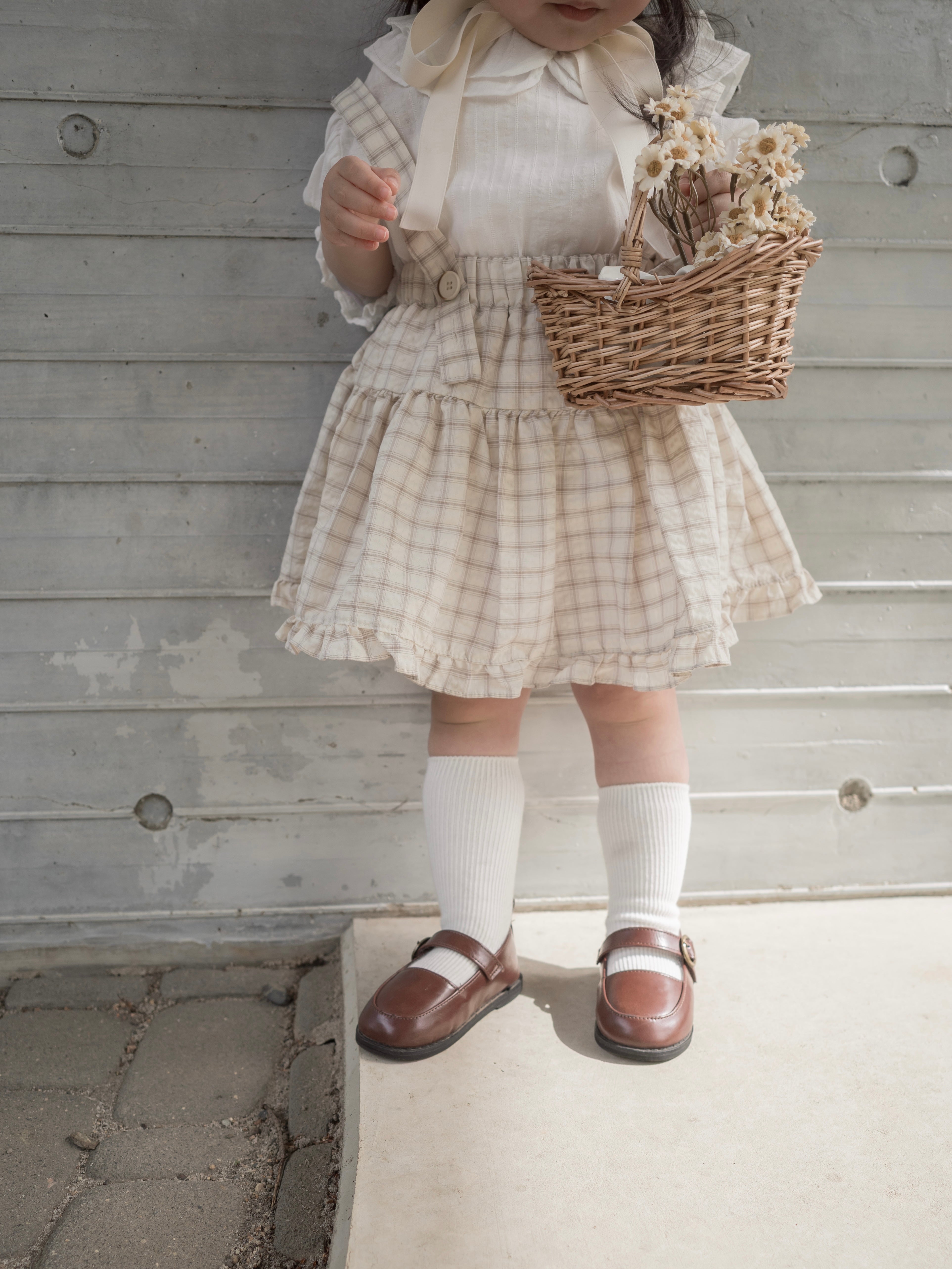 Pair check suspender skirt