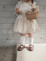 Pair check suspender skirt