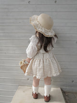 Pair check suspender skirt