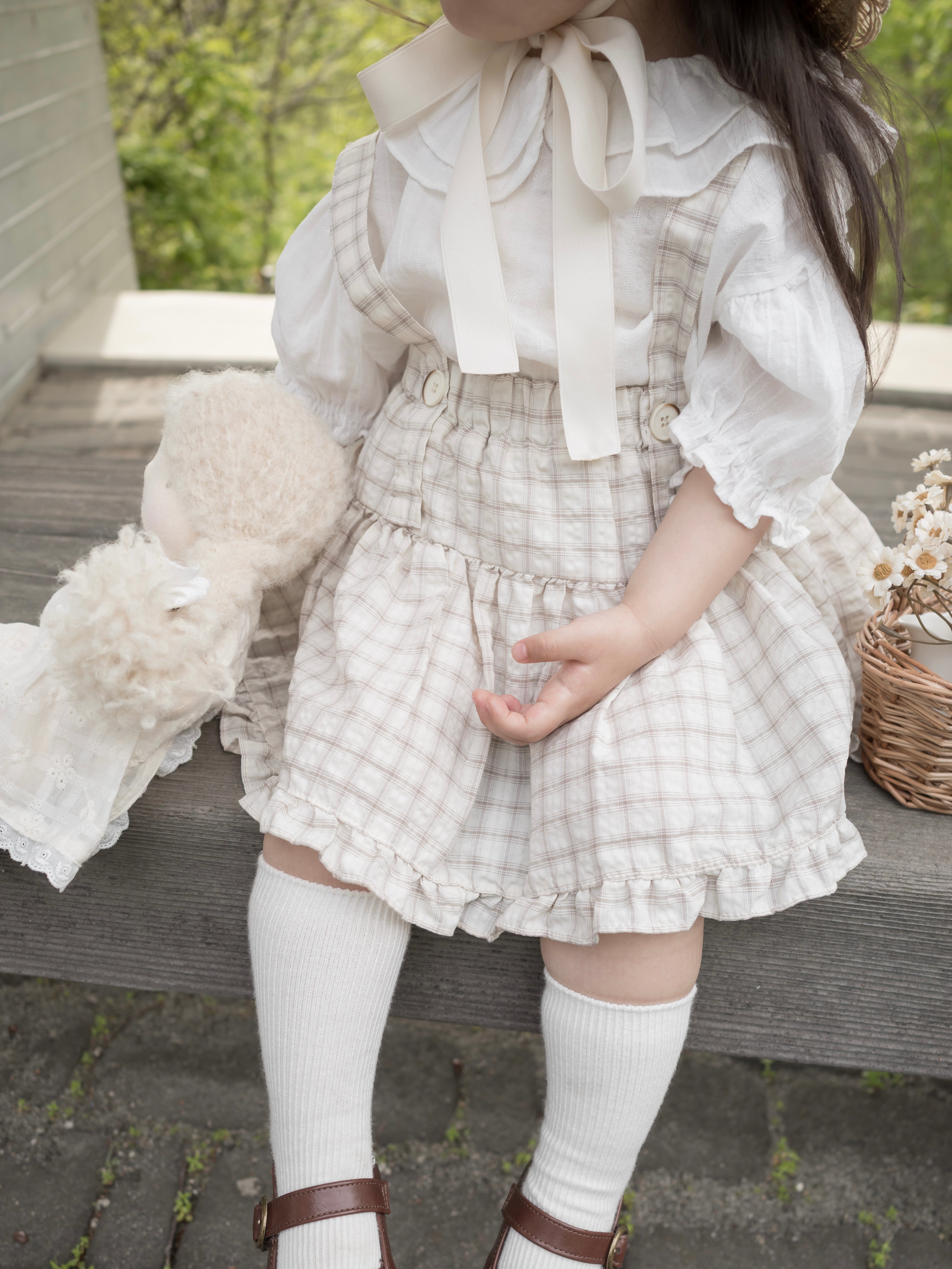 Pair check suspender skirt