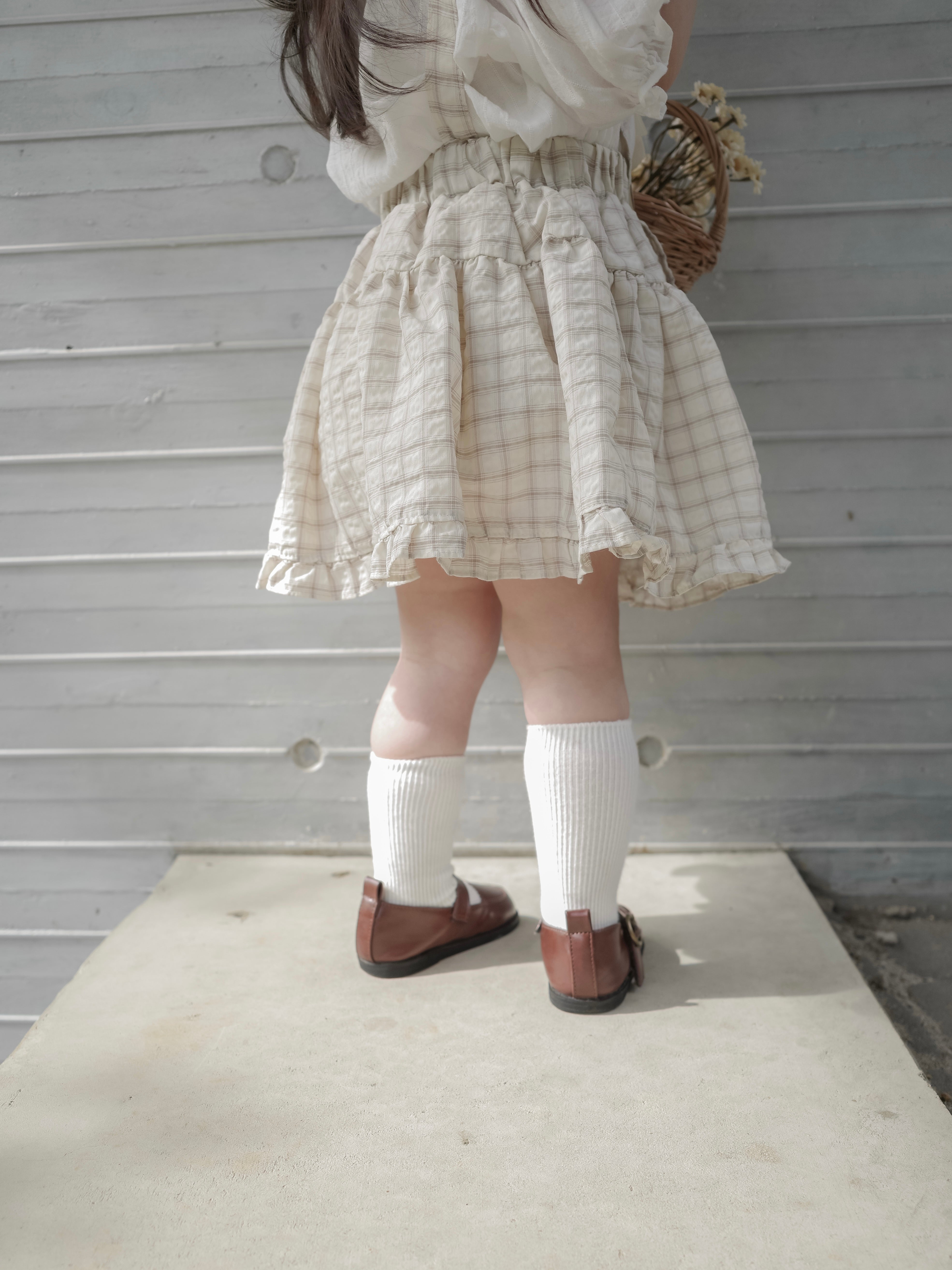 Pair check suspender skirt