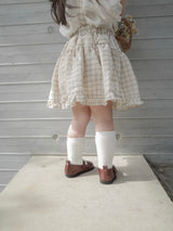 Pair check suspender skirt