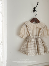 Pair check suspender skirt
