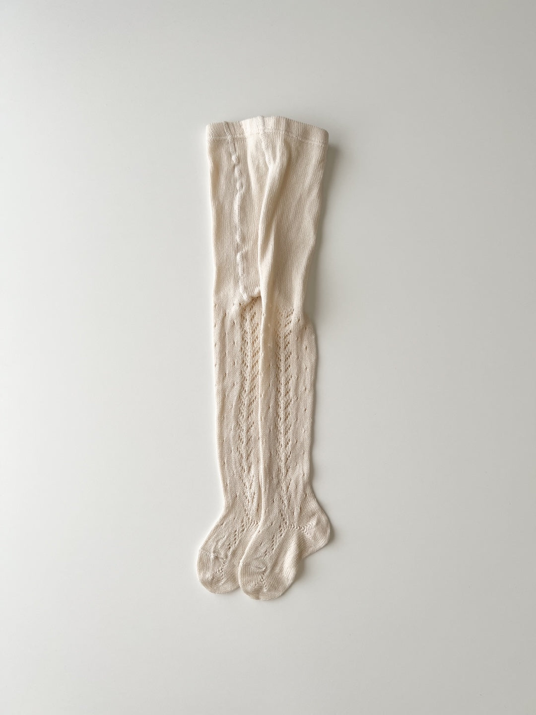 ［condor］Perle openwork tights with front dots and side spikes