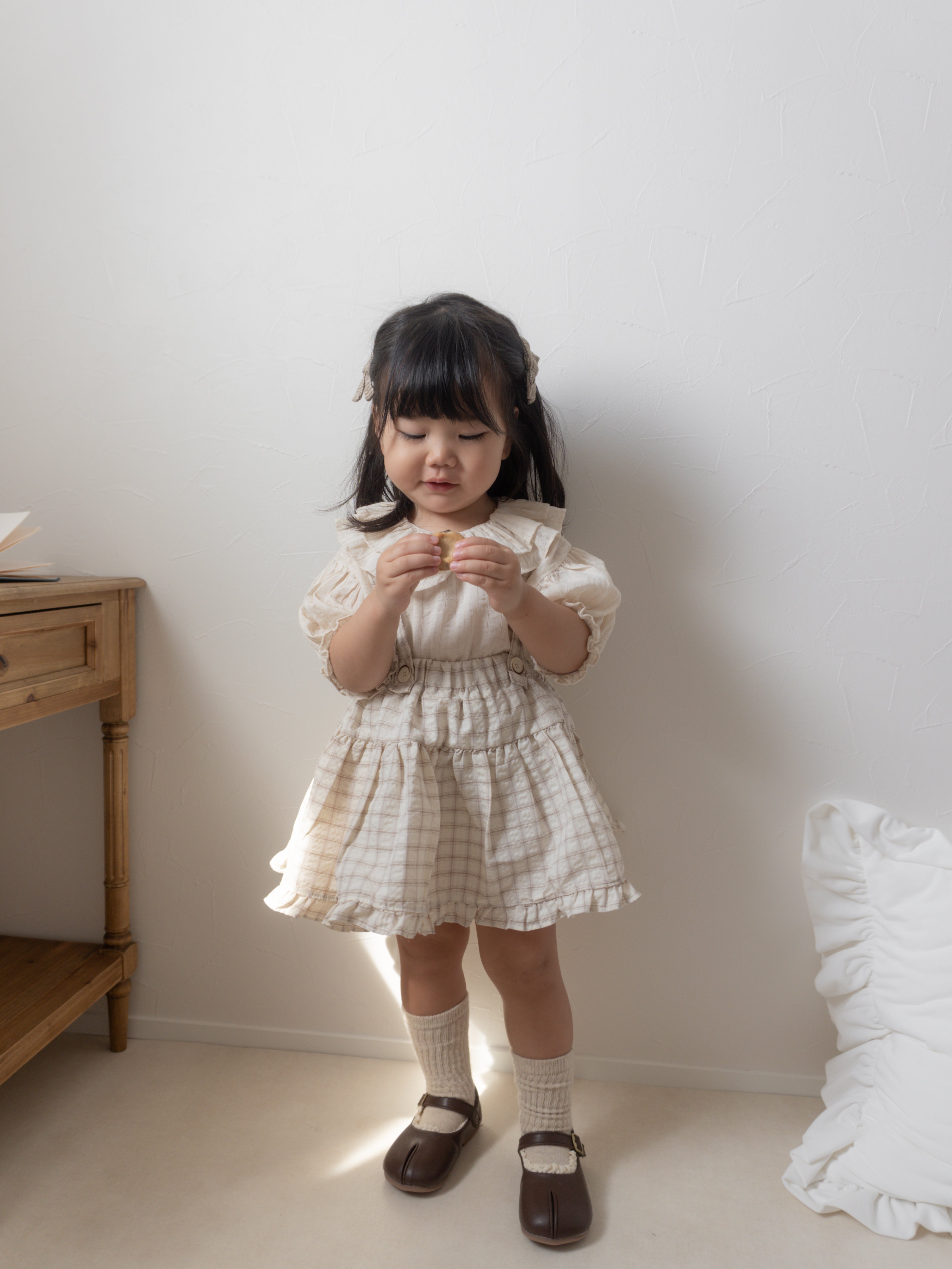 Pair check suspender skirt
