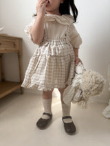 Pair check suspender skirt