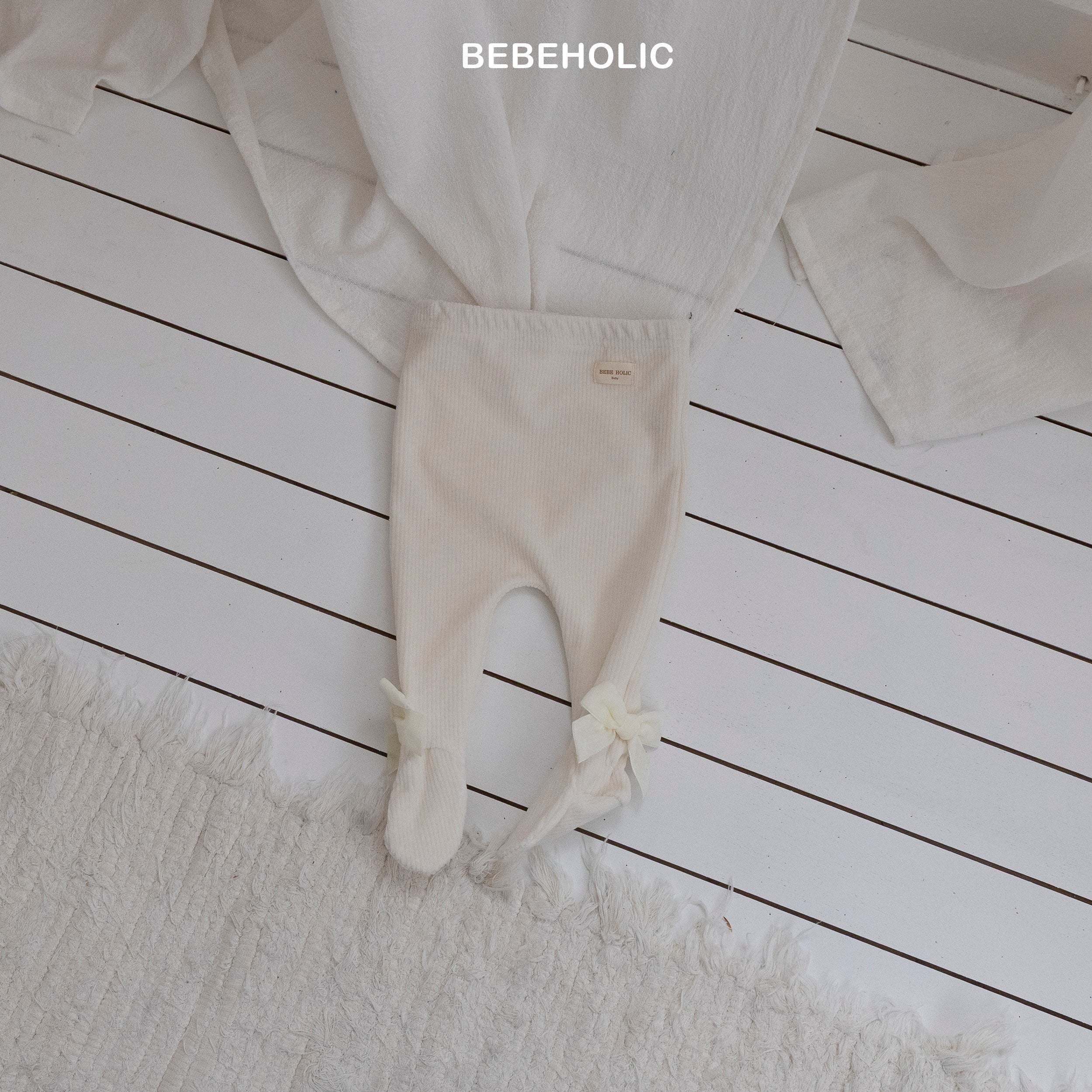 ［bebe holic］Ribbon foot leggings