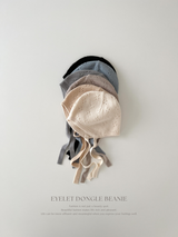 Eyelet dongle beanie