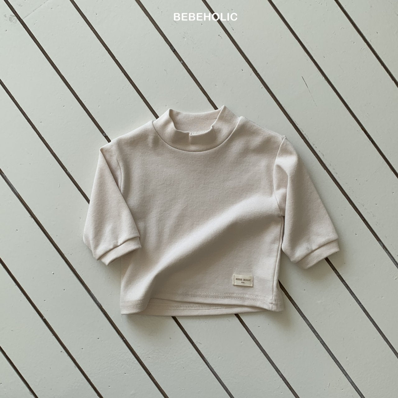 ［bebe holic］Magic half neck tee